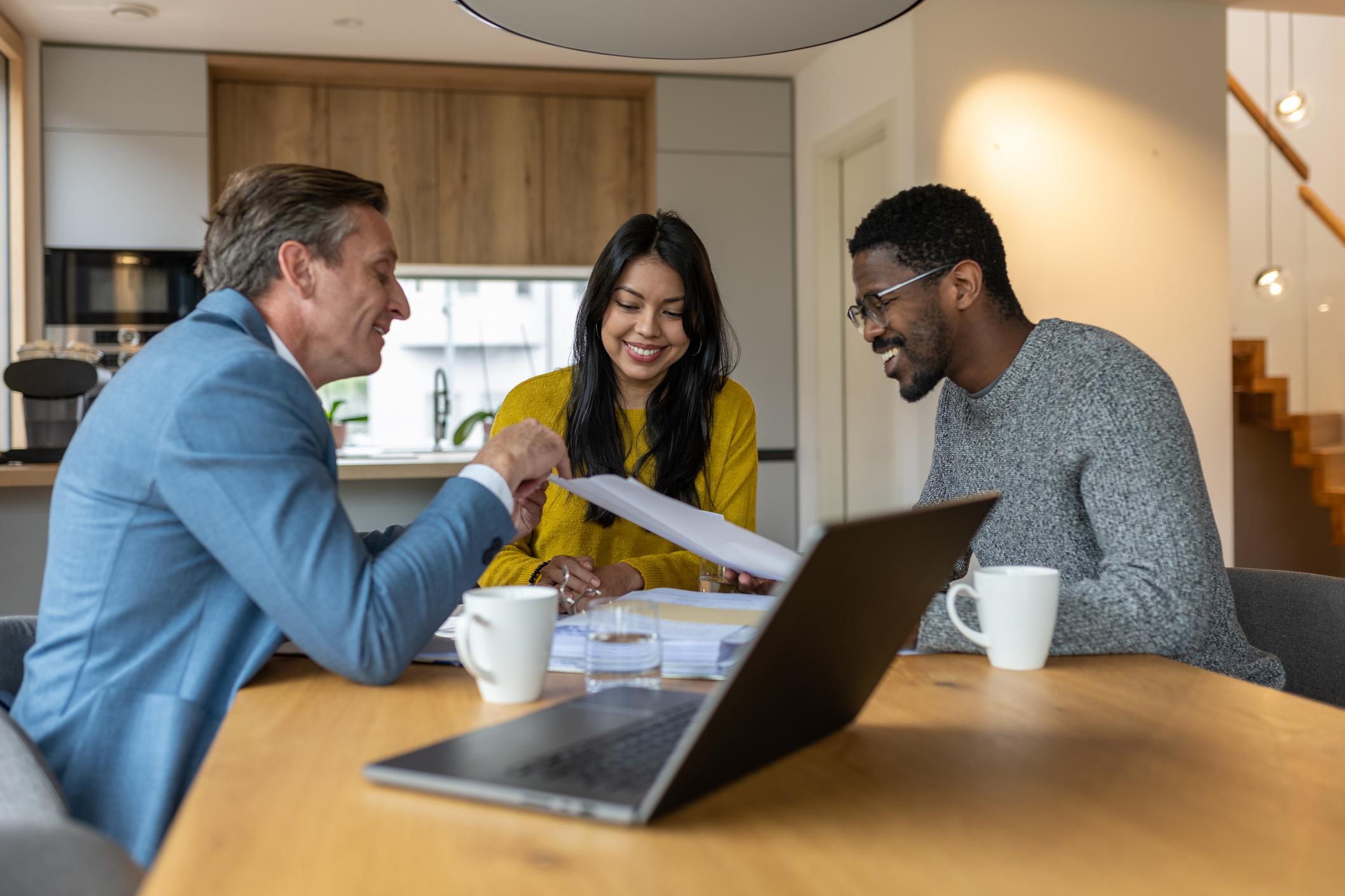 Advisor reviewing options with a homeowner couple