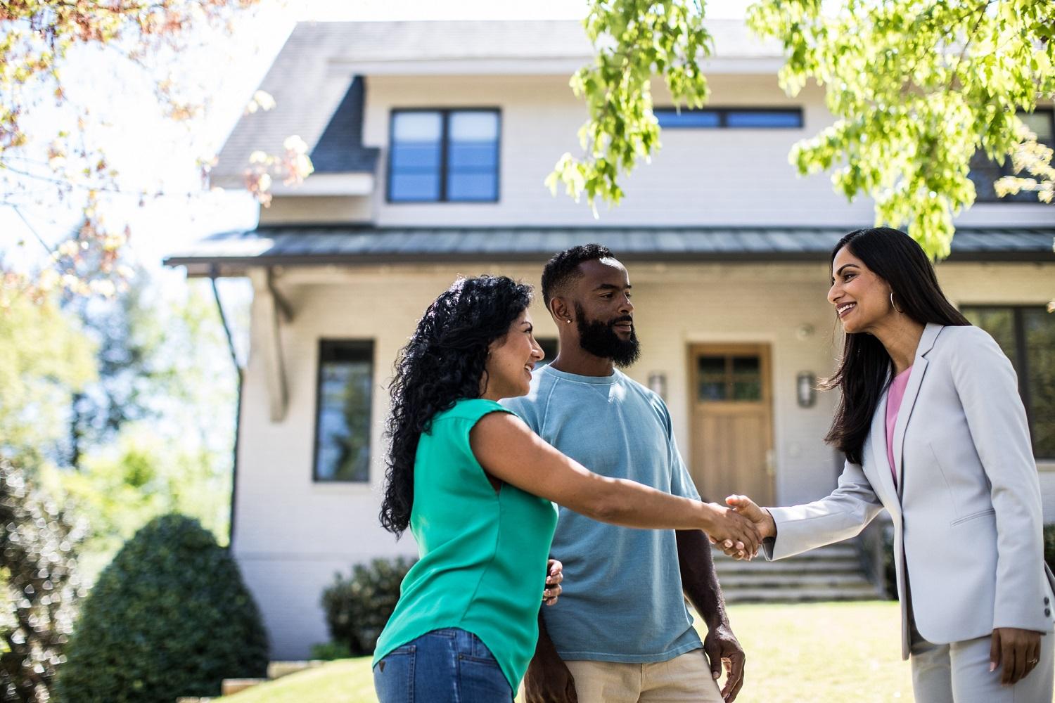 Advisor consulting with homeowners in their living room